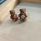 Miniature bears with flowers